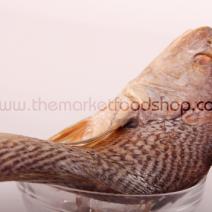 Whole croaker fish in a bowl